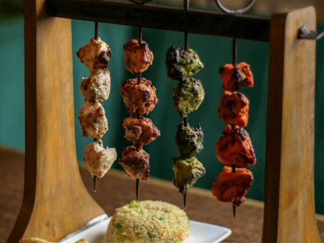 Grilled kebabs served with naan and rice, dishes common across northern Pakistan
