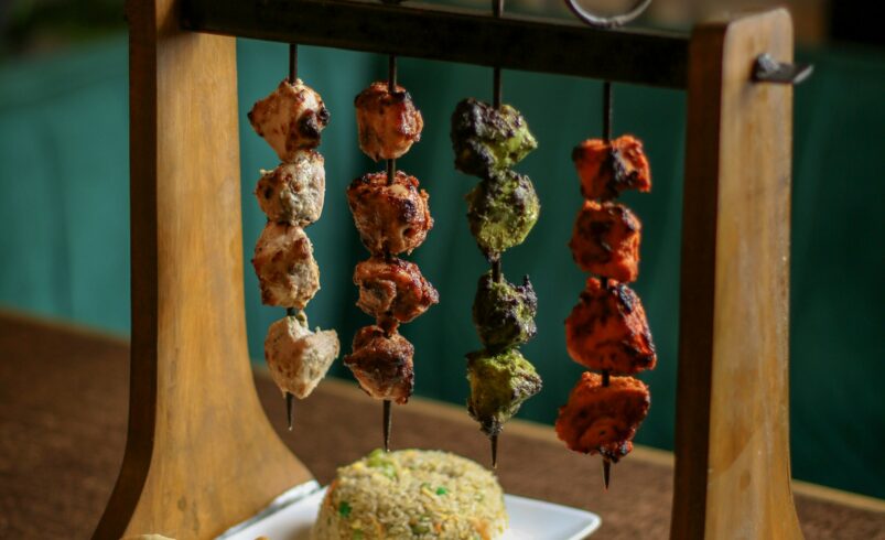 Grilled kebabs served with naan and rice, dishes common across northern Pakistan