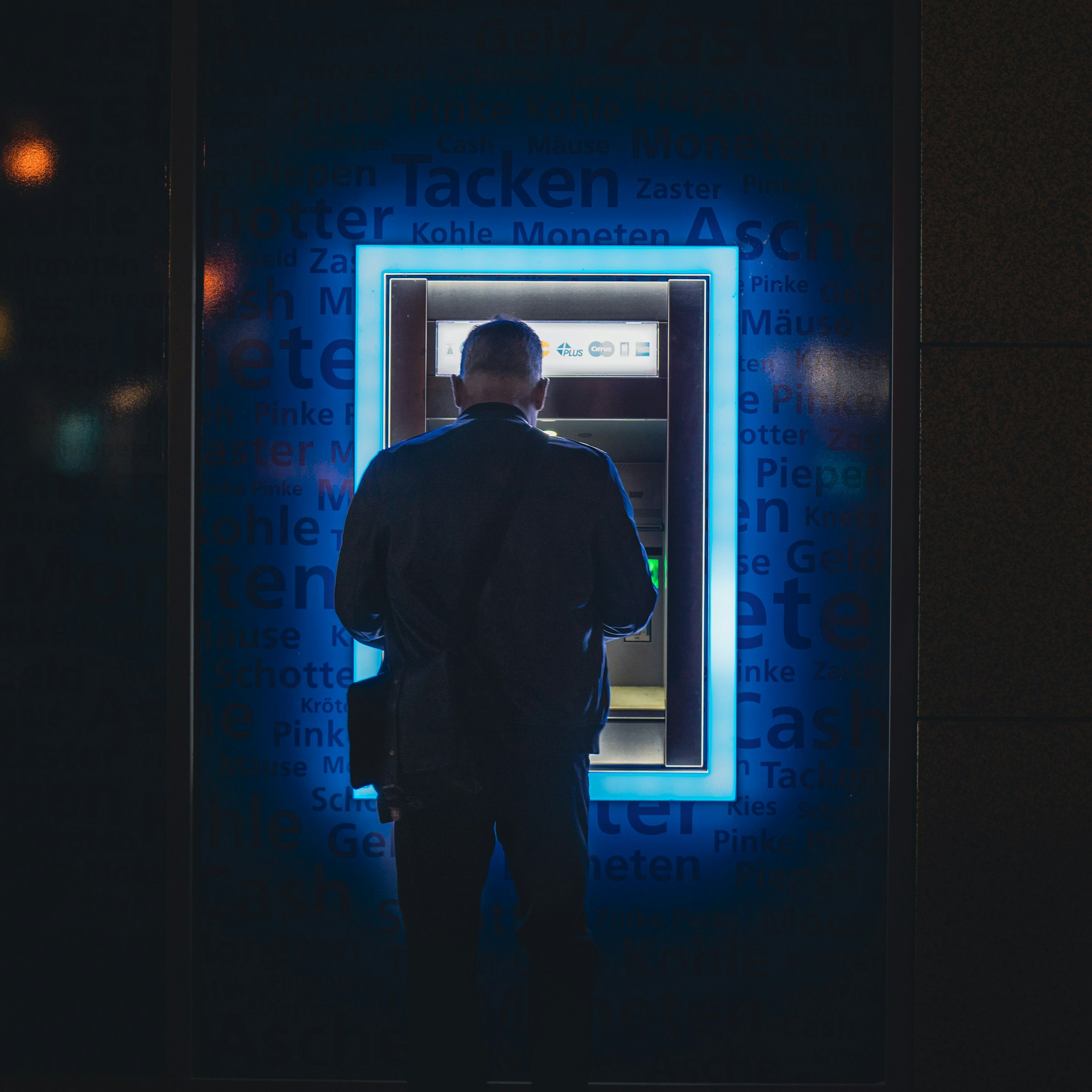 Man withdrawing cash from an ATM machine