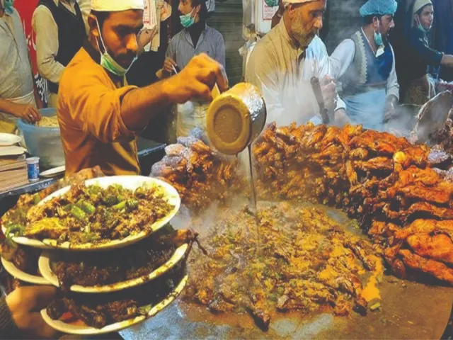 Tawa piece, spiced grilled chicken served on a Lahore food street
