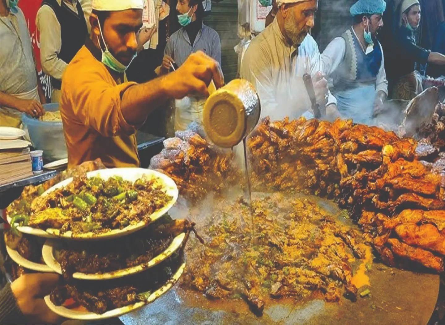 Tawa piece, spiced grilled chicken served on a Lahore food street