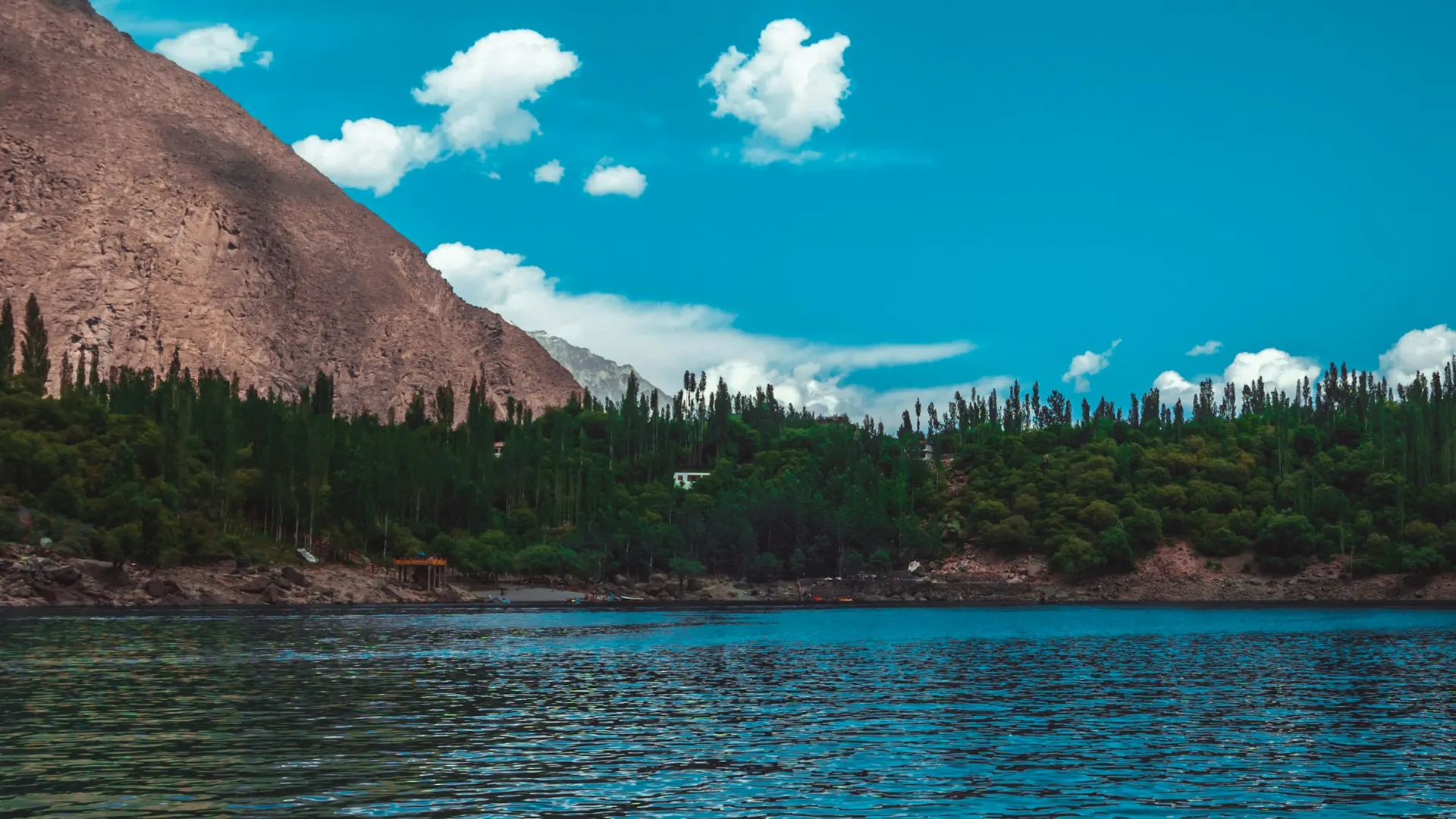Boating on a mountain lake near Skardu, similar to activities at Satpara Lake
