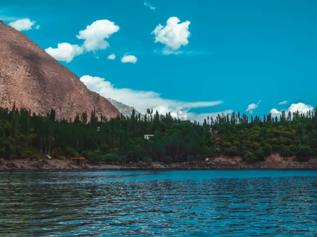 Boating on a mountain lake near Skardu, similar to activities at Satpara Lake