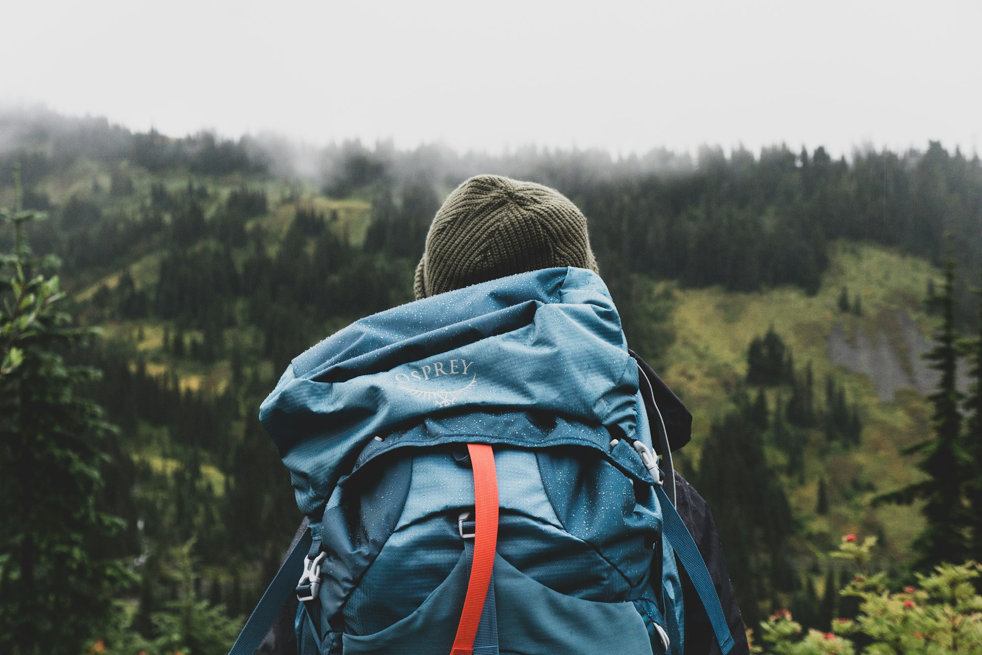 Layered clothing and backpack overlooking a mountain in northern Pakistan