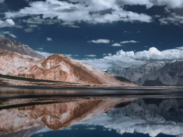 Sheosar Lake surrounded by mountains in Deosai National Park, Pakistan