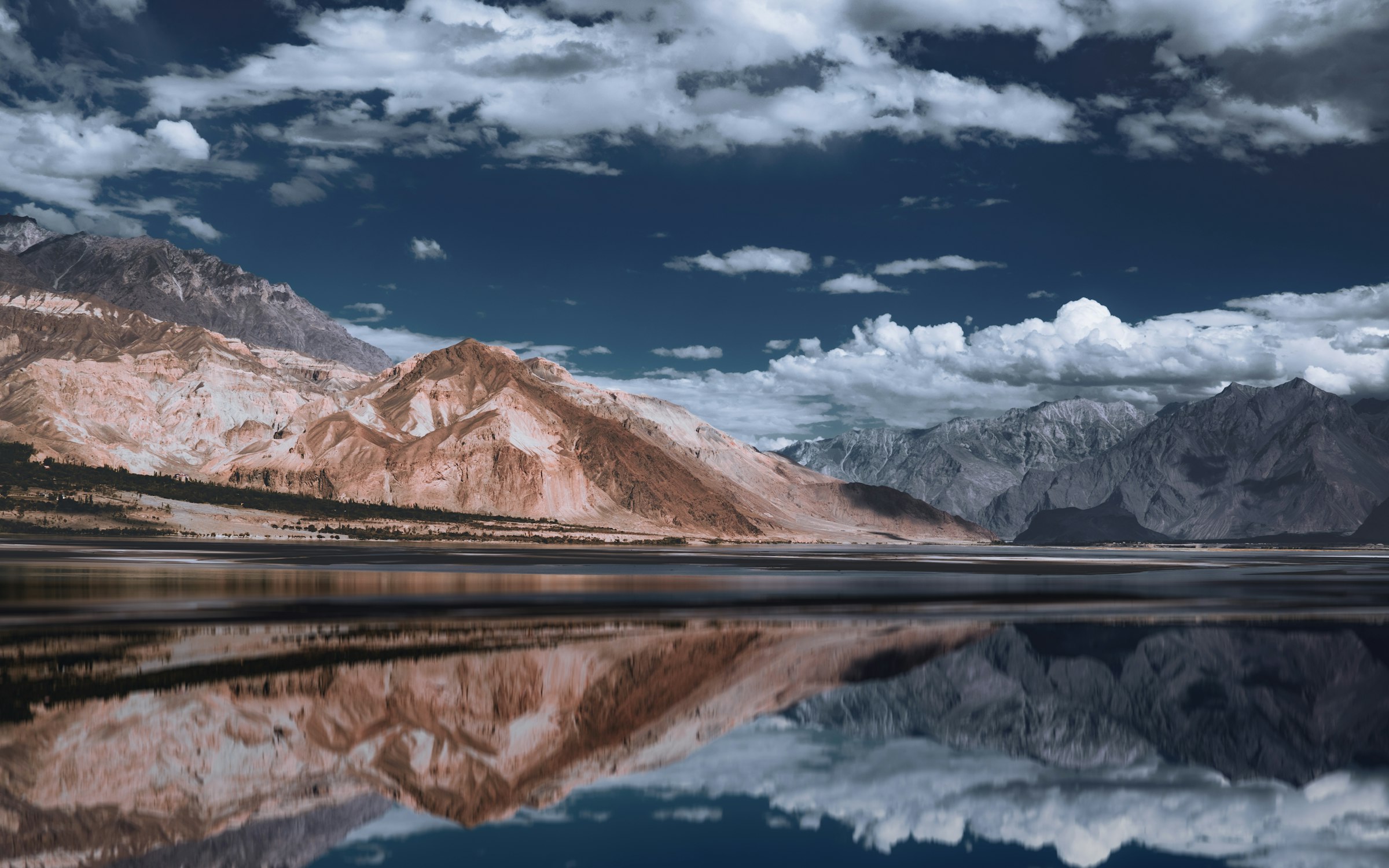 Sheosar Lake surrounded by mountains in Deosai National Park, Pakistan