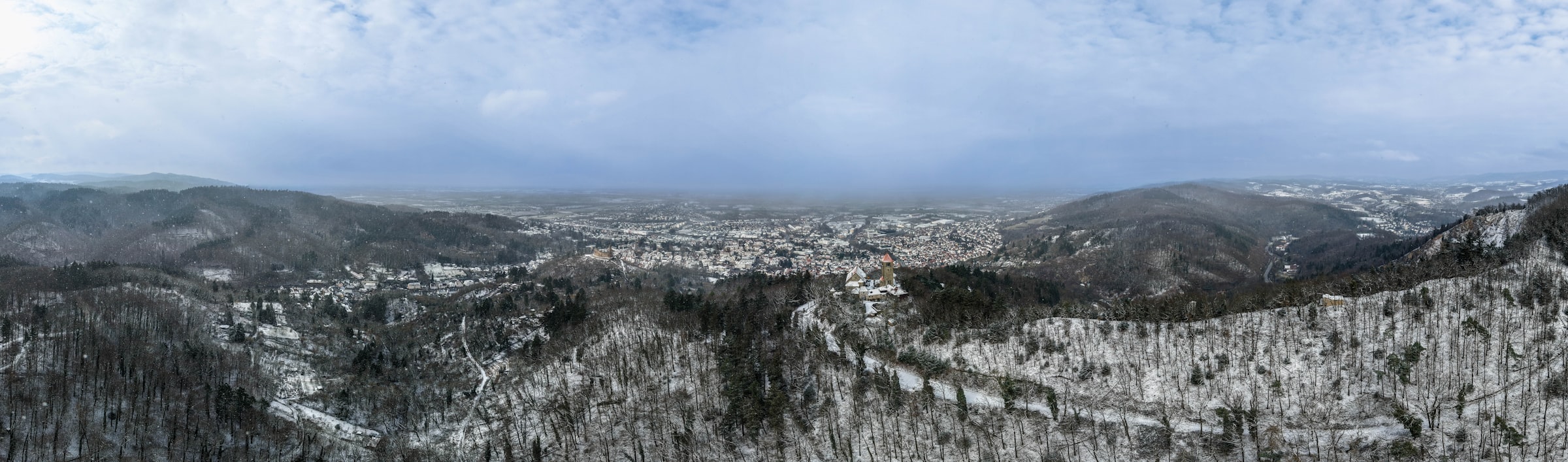View of a snowy high-altitude mountain range from a helicopter, illustrating evacuation terrain