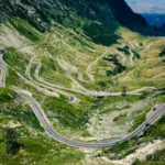 A winding mountain road seen from above, similar to sections of the Karakoram Highway