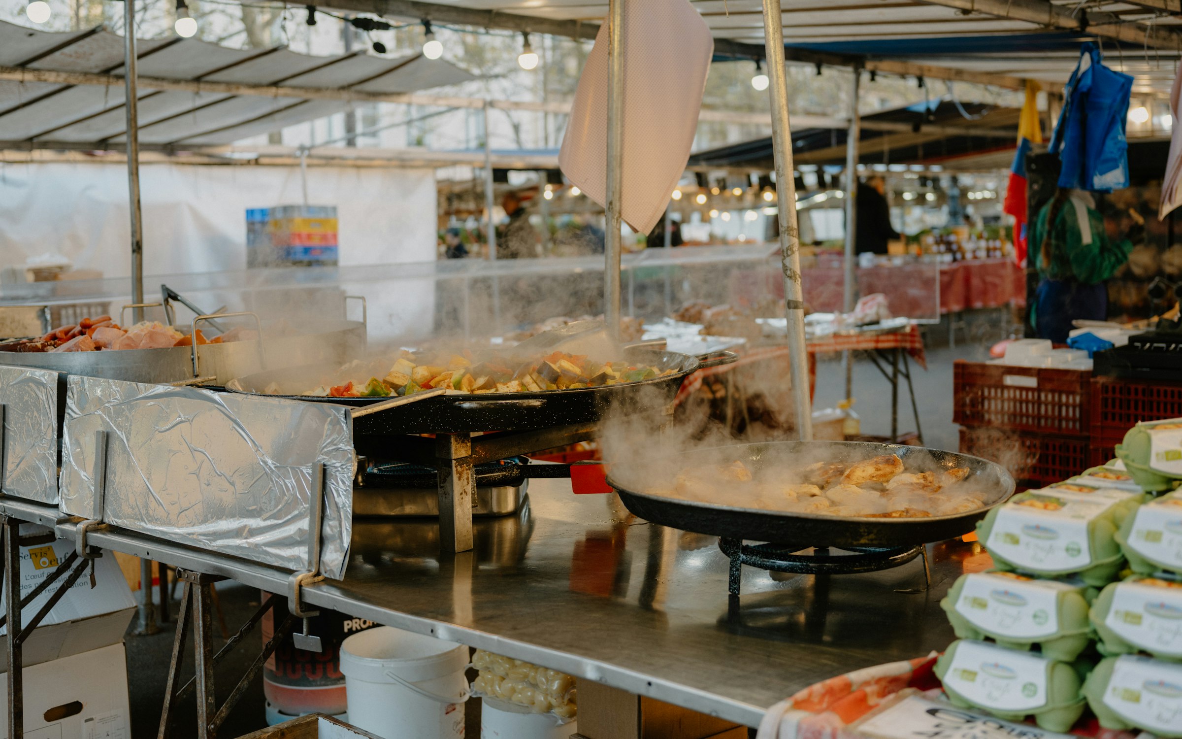Food stalls cooking fresh at an outdoor market, illustrative of street food safety practices