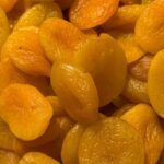 A pile of golden dried apricots, central to Hunza cuisine, Pakistan