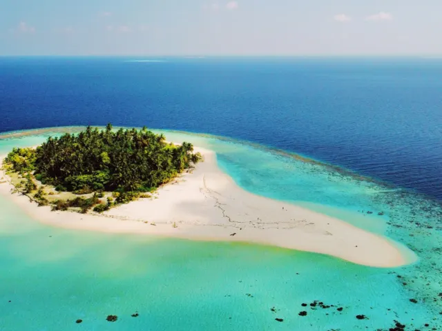 A remote, uninhabited island in the middle of the ocean, similar to Astola Island, Pakistan