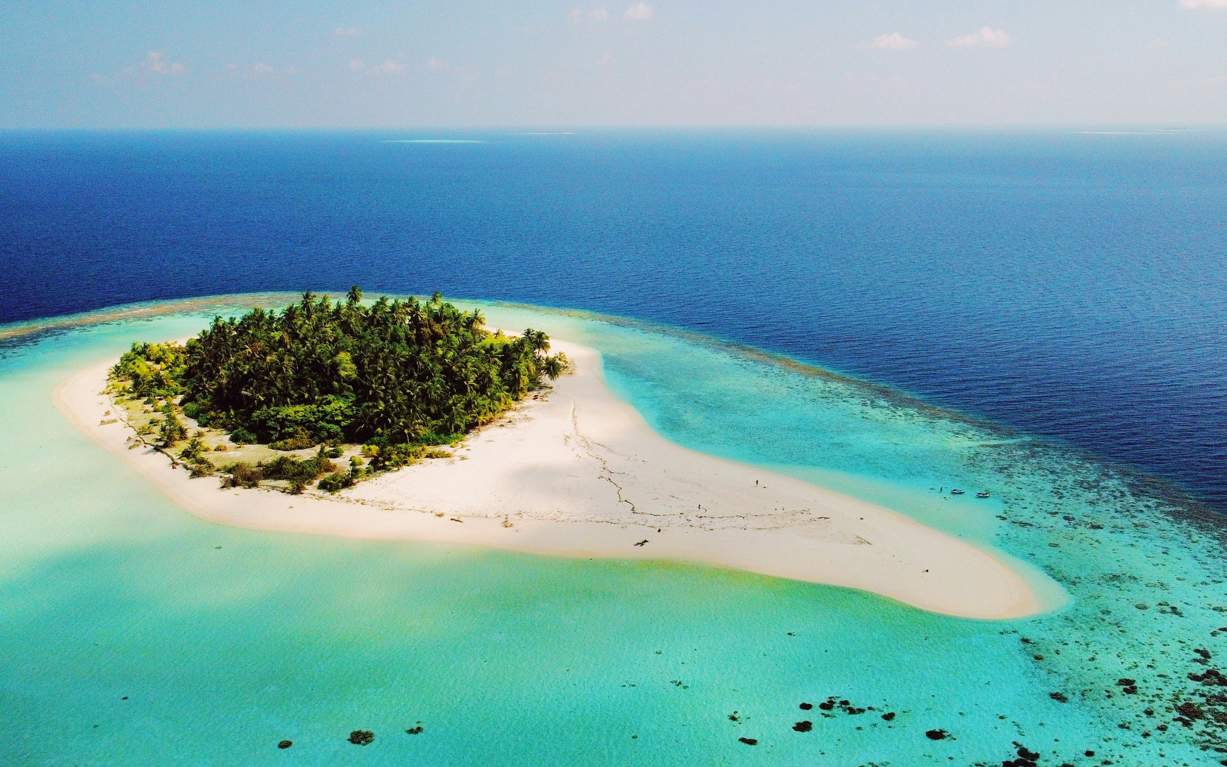 A remote, uninhabited island in the middle of the ocean, similar to Astola Island, Pakistan