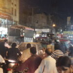 Shoppers and shopfronts on a busy street in Anarkali Bazaar, Lahore