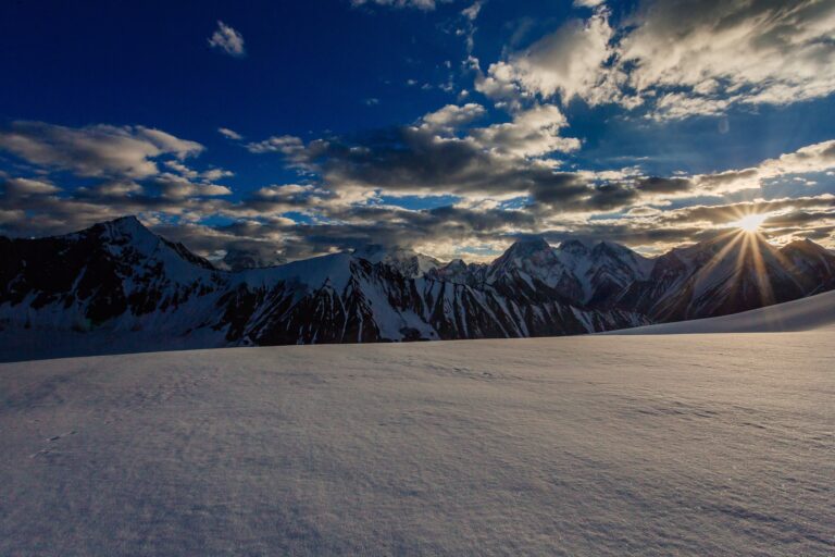 Trekkers near the snow-covered Gondogoro La pass in the Karakoram, Gilgit-Baltistan