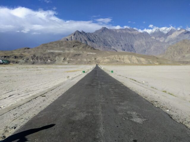 Sand dunes of Katpana Cold Desert in the Skardu Valley with mountains behind